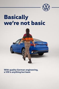 a man standing next to a blue car with the words, basically we're not basic