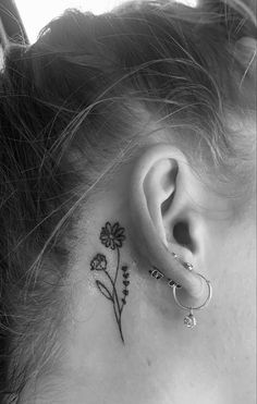 a small flower behind the ear