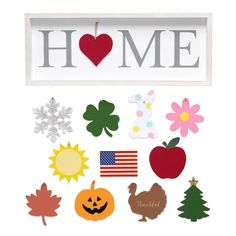 a sign that says home with many different things in it and some decorations on the front