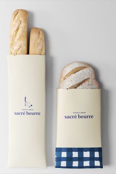 two baguettes sitting next to each other on a table