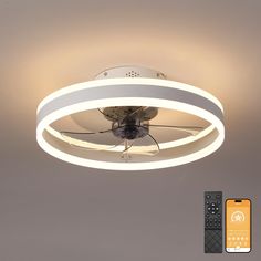 a ceiling light with remote control in front of it