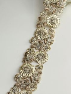 >>Light Gold Zari Appliqué Floral Cutwork  Indian Embroidered Sequin Ribbon >> for Sari, Dupatta, Wedding Outfit, Sash Sew On Trim 5cm By Yard ✨ Elevate your garments with our exquisite Light Gold Zari Appliqué Floral Cutwork Ribbon. Featuring intricate floral cutwork and shimmering sequins, this 5cm wide ribbon adds a touch of elegance to sarees, dupattas, wedding outfits, and sashes. Ideal for both traditional and contemporary designs, this sew-on trim is sold by the yard, making it perfect fo Floral Cutwork, Cutwork Embroidery, Wedding Sash, Traditional Sarees, Cut Work, Sew On, Floral Embroidery, Wedding Outfit, Accessory Gift