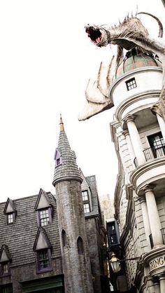 a dragon statue on top of a building