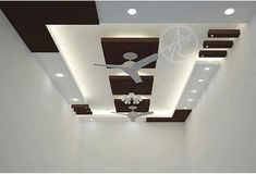 an empty room with white walls and ceiling fans on the ceiling, along with recessed lighting