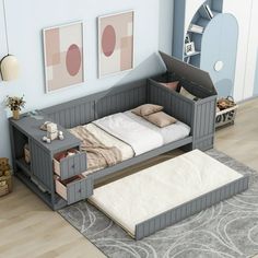 a bedroom with a bed, dresser and rug