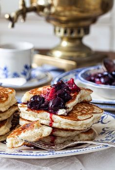 pancakes with blueberries and syrup on a plate