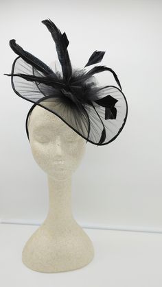 Classic large black Fascinator for every occasion. Light weight and classic addition to your outfits. It can customized with different colors of feathers and or flowers. Do you want it in a different color? Send me a message. - 40 inches contour brim - Rare find - Ready to ship - Fast Shipping - Free Shipping - Group discount available - Customize by adding different color flowers and or feathers Check my store for for styles and colors. Hatsandpearls.etsy.com Find more at my website for more st Feather Trim Mini Hats For Kentucky Derby Evening, Kentucky Derby Evening Mini Hat With Feather Trim, Evening Mini Hat With Feathers And Short Brim, Black Feathered Fascinator For Kentucky Derby, Ostrich Feather Fascinator For Kentucky Derby Evenings, Fitted Feather Fascinator For Evening, Chic Fascinator With Feathers For Races, Elegant Feathered Party Hats And Headpieces, Fitted Party Hats With Feather Trim