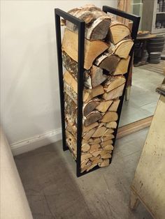 a stack of logs sitting in front of a mirror