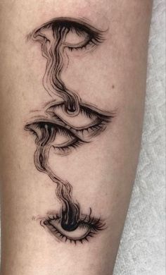 a woman's leg with an artistic tattoo design on the side of her leg