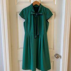 J. Crew Tie-Neck Short Sleeve Dress ~New With Tags ~Size: 6 ~Color: Green With Navy Trim ~Fully Lined ~Back Zipper ~Pleats ~See Photos For Measurements Green Lined Midi Dress For Formal Occasions, Green Lined Midi Dress For Formal Events, Green Short Sleeve Mini Dress For Formal Occasions, Green Midi Dress For Semi-formal Occasions, Green Semi-formal Midi Dress, Formal Green Short Sleeve Mini Dress, Green Short Sleeve Semi-formal Dress, Green V-neck Office Dress, Green Semi-formal Summer Dress