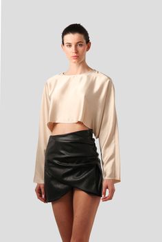 The Emilia Top is a Nonchalant classic. One of our best sellers, it is a long-sleeve satin top with a raw hem for added texture. The fabric adds to the silky effect and is easily paired with any bottom. Available in various colors. Satin Blouse And Skirt, Leather Mini Skirt, Asymmetrical Skirt, Satin Blouse, Satin Top, Cute Everyday Outfits, Leather Mini Skirts, Leather Mini, Satin Fabric