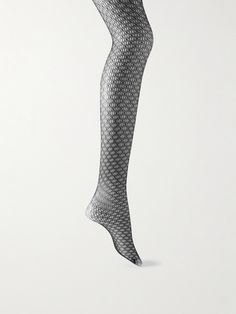 Wolford's tights are made from fine fishnet that feels understated thanks to the matte, semi-opaque construction. They're blended with plenty of stretch and have a logo-jacquard waistband designed to lay flat. Tight Fishnet Stockings For Night Out, High Stretch Fishnet Tights, Sheer Stretch Mesh Stockings, Tight Thigh-high Mesh Stockings, Fitted Fishnet Stockings For Night Out, Chic Black Fishnet Hosiery, Sheer Mesh Thigh-high Legwear, Chic Fishnet Thigh-high Hosiery, Chic Fishnet Thigh High Hosiery