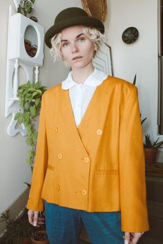 "This mustard yellow double breasted blazer is quite possibly the perfect springtime blazer! The color is vivid and the fit is fabulous! Size marked: 12 Measurements- Shoulder to shoulder: 18\" Chest: 42\" Length: 23\" All sales are final! Our items are VINTAGE, meaning they have a 15+year history, a story! Due to the previous wear and passage of time, they may have resulting flaws or imperfections. If you have any questions or need more information and/or photos of items, feel free to reach out Tailored Buttoned Blazer For Spring, Tailored Blazer With Buttons For Spring, Tailored Spring Blazer, Yellow Fitted Blazer For Work, Orange Formal Outerwear For Spring, Spring Formal Orange Outerwear, Formal Orange Outerwear For Spring, Chic Orange Blazer For Spring, Yellow Spring Office Blazer