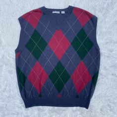 Brand New 100% Cashmere Argyle Patterned Men’s Sweater Vest In Perfect Condition, Size Xxl. Brand Is American Blue. Original Tags Attached, Unworn. No Flaws Or Imperfections! Dark Navy Blue With Red And Green Argyle Pattern On The Front. Classic Sweater Vest! Can Be Worn Casually, Can Be Dressed Up, Can Be Dressed Down. Perfect Sweater For The Fall/ Winter/ Holiday Months High-Quality Material And Extremely Soft. Sleeveless. V Neck. Pit To Pit- 24.5” Length- 28.5” From A Smoke Free Home. Offers Winter V-neck Argyle Pattern Top, Classic Blue Winter Sweater Vest, Classic Blue Sweater Vest For Winter, Cashmere Sweater Men, Argyle Sweater Vest, Perfect Sweater, Mens Cashmere, Henley Sweater, Argyle Pattern