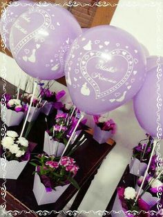 purple balloons with hearts and flowers in them