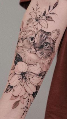 a cat with flowers on it's arm