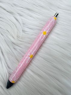 a pink pen sitting on top of a white fur covered floor