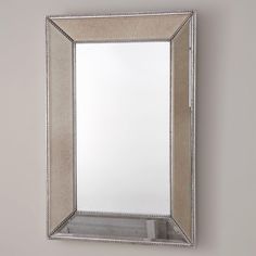 a large mirror hanging on the wall