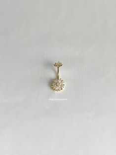 a single diamond earring on a white background