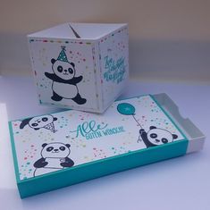 an open box with a panda on it next to another box that says,'we are birthday wishes '