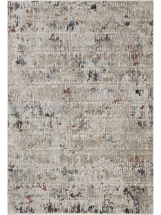 an area rug with various colors and patterns on it, including beiges, browns, blue