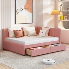 a living room with a pink couch and ottoman