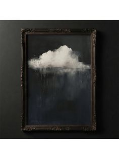 a painting hanging on the wall in front of a black wall with a white cloud above it