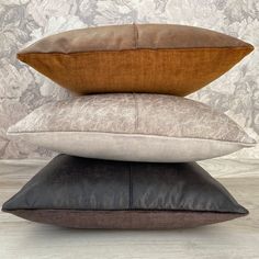 three pillows stacked on top of each other