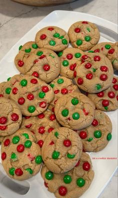 there is a platter full of cookies with m & m candies on them