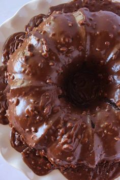 a chocolate bundt cake on a plate with the words texas sheet cake bundt cake