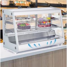 an image of a bakery display case with food in the front and on the back