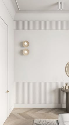 a white room with two round lights on the wall