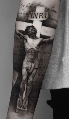 a man with a cross on his arm