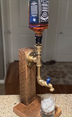 an old fashioned faucet turned into a whiskey dispenser