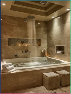 a bathroom with a large jacuzzi tub next to a toilet and shower head