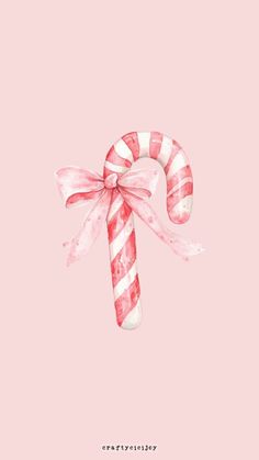 a candy cane with pink and white stripes on it's side, against a pink background