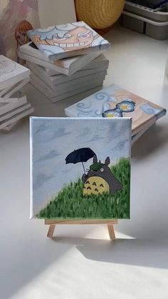 there is a small card with an image of a person holding an umbrella on it