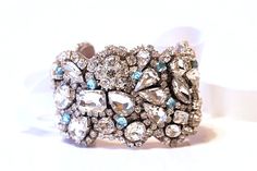 Just be gorgeous on your wedding day! This Statement piece will complete your bridal ensemble or add sparkle to any other special occasion. Please let me know your wrist size so it can be custom fit to your size. * Cuff Features* Completely unique Just under 1 3/4 wide at widest Old Hollywood Vintage, Bridal Cuff Bracelet, Pico Rivera, Crystal Place, Bridal Cuff, Hollywood Vintage, Hollywood Style, Crystal Shapes, Matching Necklaces