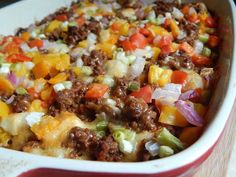 a casserole dish with ground beef and vegetables