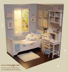 a dollhouse bedroom with a bed, desk, and chair in it's corner