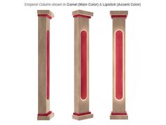 three tall red and beige pillars with lights on them