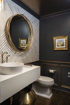 This formal powder was designed around stunning marble and gold wall tile.  A floating quartz countertop houses a vessel bowl sink, wood panel and molding’s were painted black with a gold leaf detail which carried over to the ceiling for the WOW. Transitional Cottage, Traditional Powder Room, Half Bath Remodel, Powder Room Remodel, Half Bathroom Decor, Powder Room Decor, Bath Renovation, Brown Floors