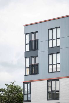 an apartment building with multiple balconies and windows