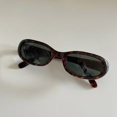 These round oval sunglasses are your everyday classic.  Featuring a brown tortoise frame with smoke lens.  This style is unisex.  True genuine vintage sunglasses from the 90s.   - 400 uv  - new vintage from the 90s - includes sunglasses pouch  Also available in black https://etsy.me/3p1yraW French Connection Sunglasses Tortoise Shell, 90s Sunglasses Vintage, 90s Sunglasses, Sunglasses Pouch, Gift Inspo, Tortoise Sunglasses, Brown Sunglasses, Rectangle Sunglasses, Oval Sunglasses