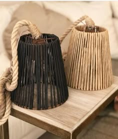 two baskets sitting on top of a wooden table