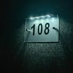 a sign that reads 108 on it in the dark