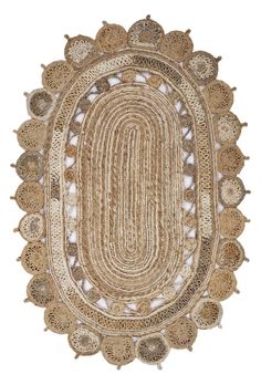 an oval rug with crochet and fringes on the bottom, in beige