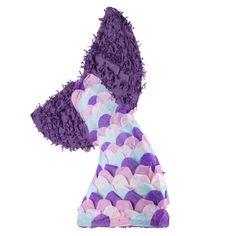 a purple and blue dog toy with ruffled edges on it's back, sitting in front of a white background