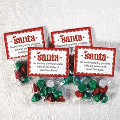 three candy candies with santa's sayings on them