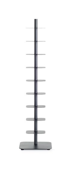 a tall metal pole with several shelves on it's sides and one standing upright